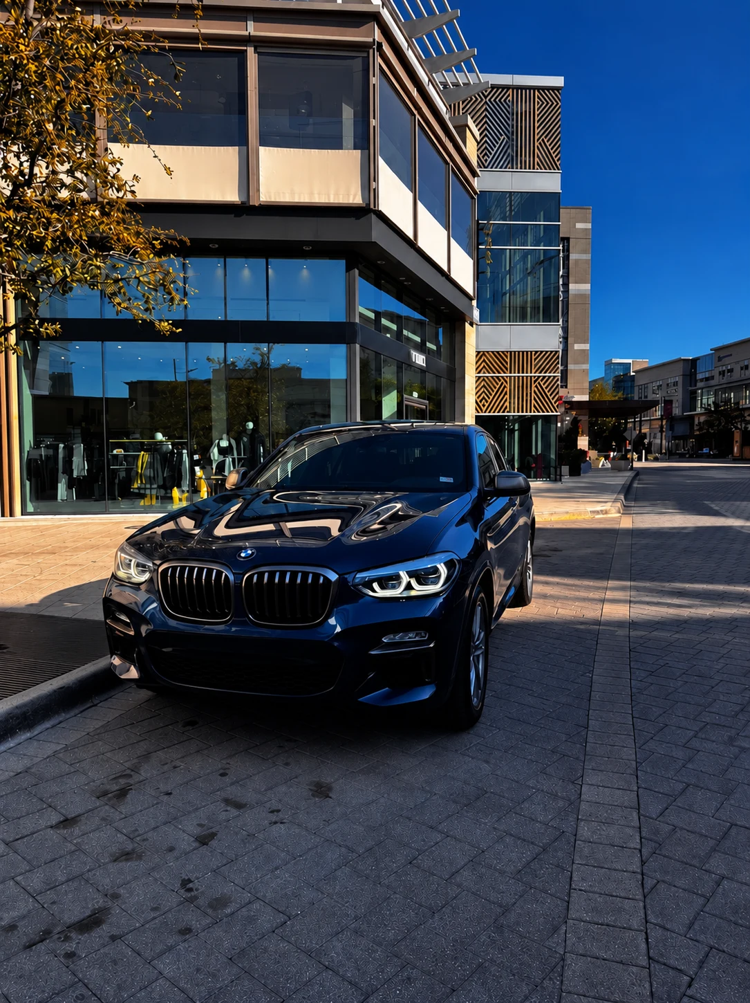 Blue BMW X4 at Legacy West