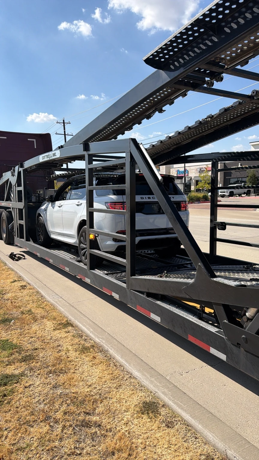 Land Rover Discovery Sport secured on a vehicle transporter