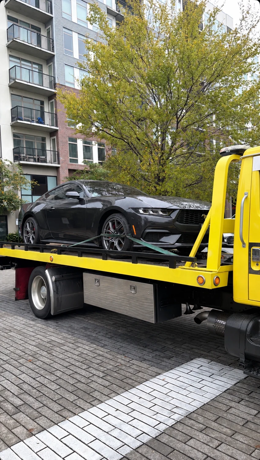 Ford Mustang arriving on a vehicle transporter