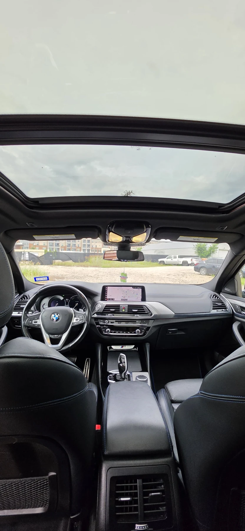 BMW cabin with panoramic roof and black seats